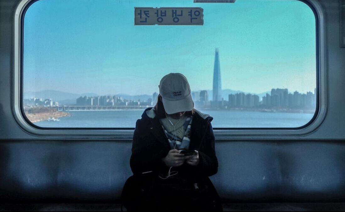 A woman on a train in Korea